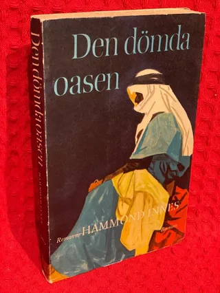 Den dömda oasen av Hammond Innes - omslag